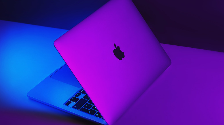 Apple MacBook Pro half-folded on a table