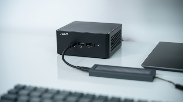 Asus Nuc Mini PC plugged in while on a table