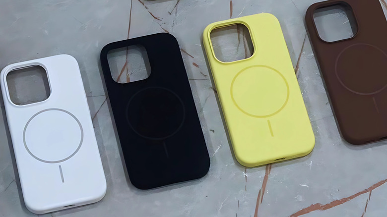 four multi-colored magsafe-compatible iPhone cases placed on a marble-like surface