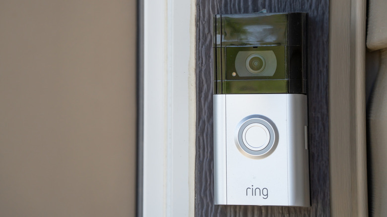 A Ring video doorbell mounted to the exterior of a building