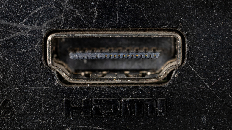A closeup of an old and dusty HDMI port