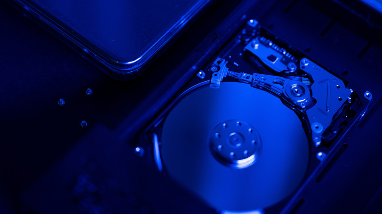 A hard drive with its internal components visible