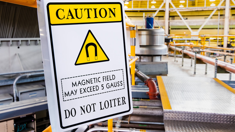 Caution sign for dangerous magnetic field in factory setting
