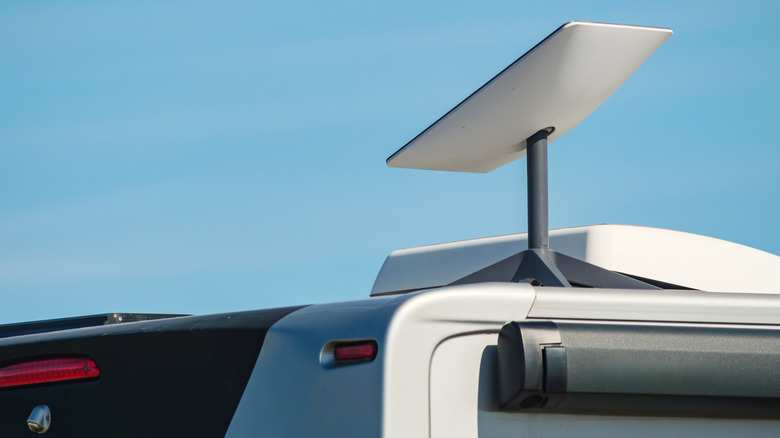 Starlink satellite internet dish attached to the roof of an RV.