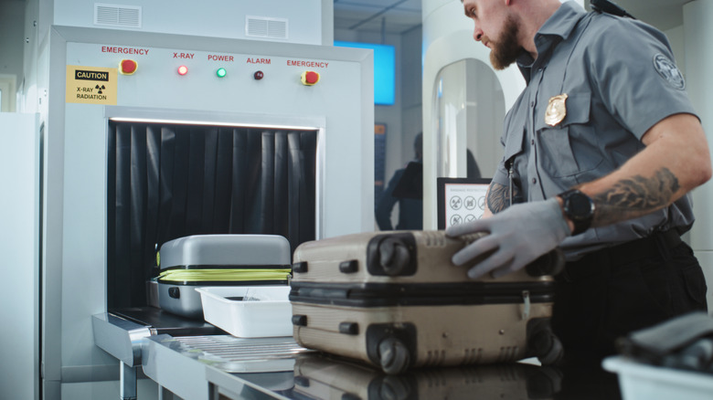 TSA inspection of devices on an X-ray scanner