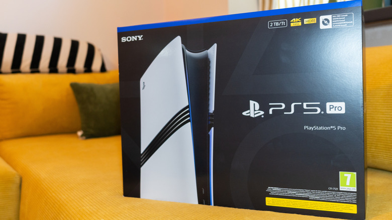 A PS5 Pro box on a sofa