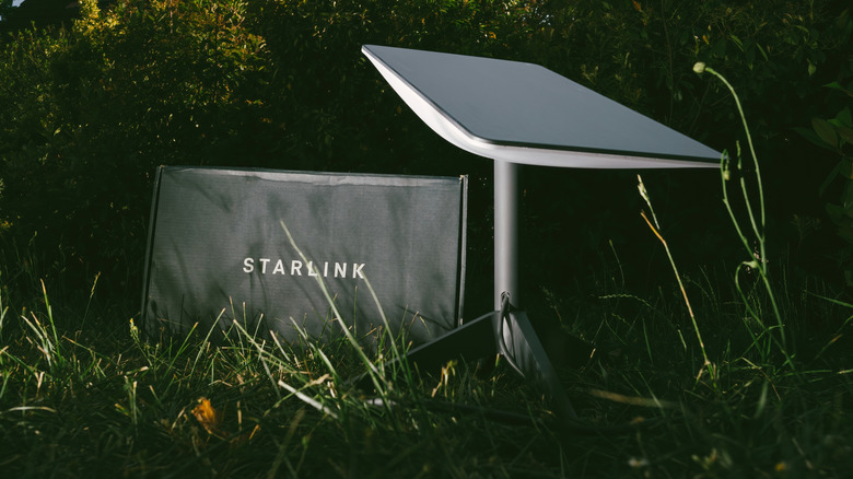 Starlink satellite receiver setup outside in wilderness