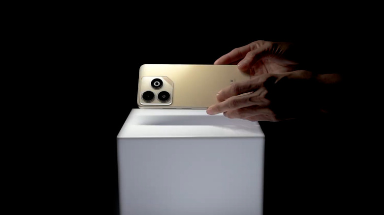 The Blu Bold K12 in a golden color with three rear cameras.