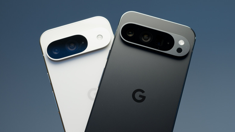 A black Google phone side-by-side with a white Google phone against a black backdrop