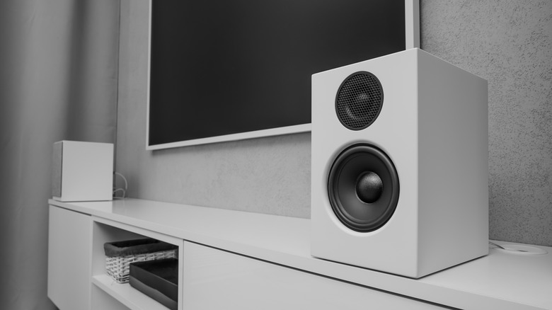 A sound system sitting beneath a TV.