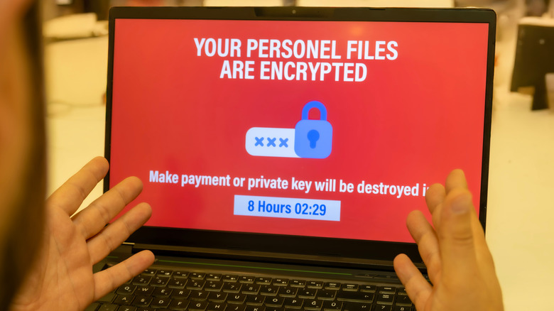 A laptop showing a splash screen created by ransomware