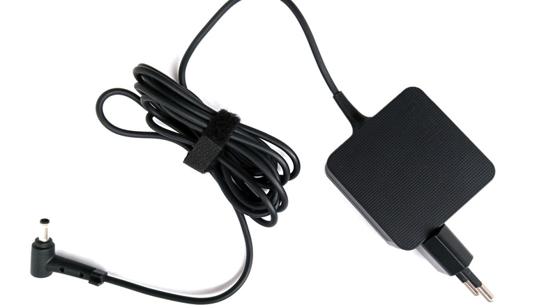 a black laptop charger and cable