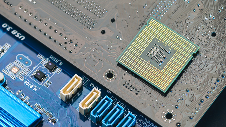 Close-up view of a Motherboard and a CPU.