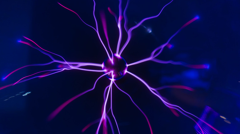 Plasma ball with purple electrical discharges