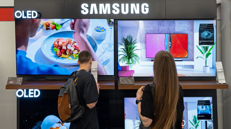 A Samsung OLED TV display at an electronics store.