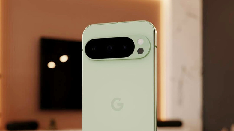 A Google Pixel 10 Pro in Jade standing upright with its distinctive camera 