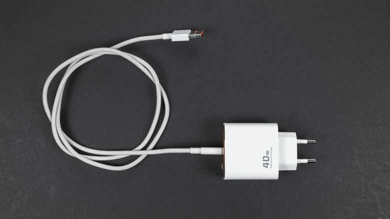 A USB-C cable with power adapter on a dark background