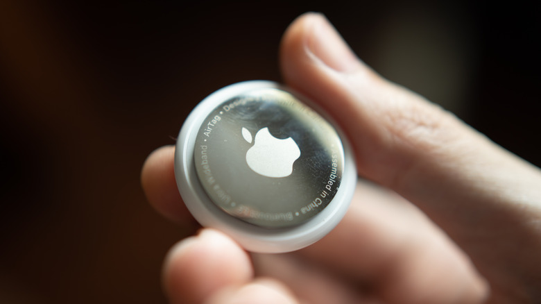 Apple AirTag in a hand