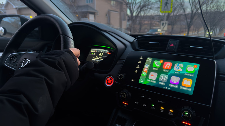 Apple CarPlay apps showing on the screen inside a car.