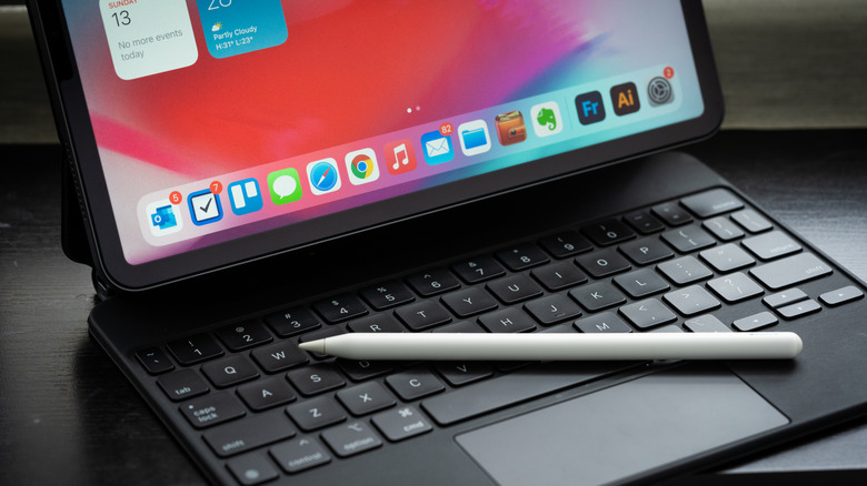 An Apple Pencil on top of an iPad Pro's Magic Keyboard.