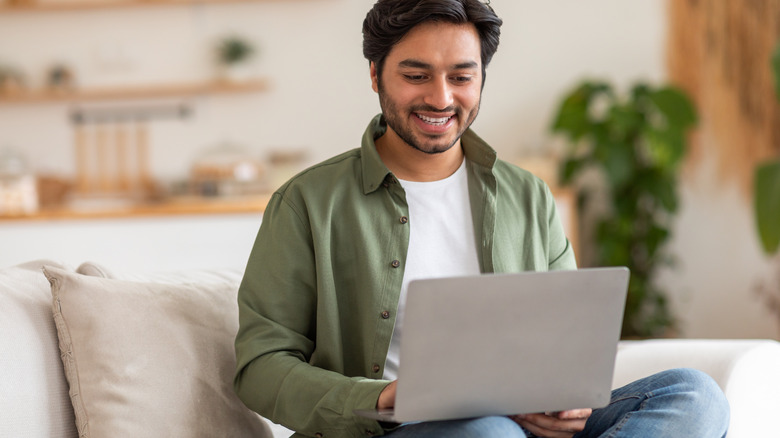 Person using computer at home