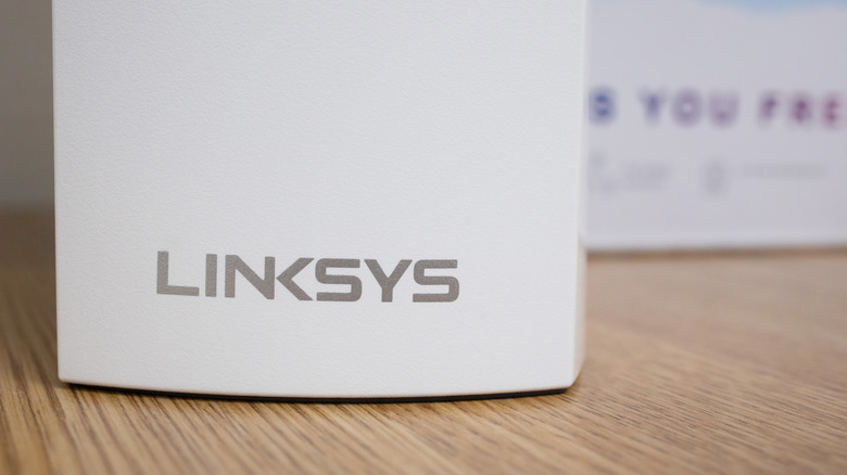 Linksys logo on the bottom of a router close up.