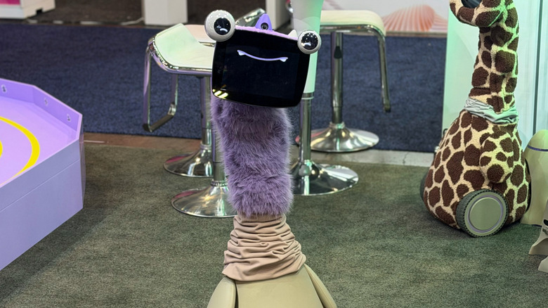 Ollobot robot standing on CES 2026 show floor