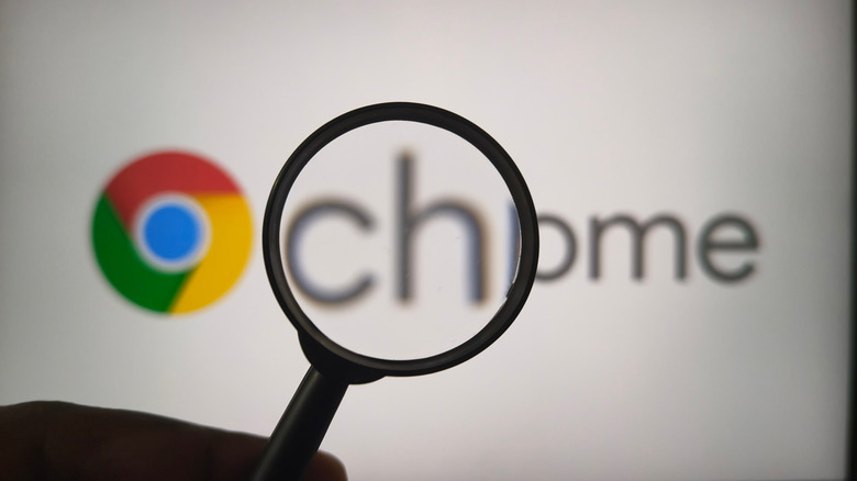 Google Chrome logo and name in background with magnifying glass in foreground.