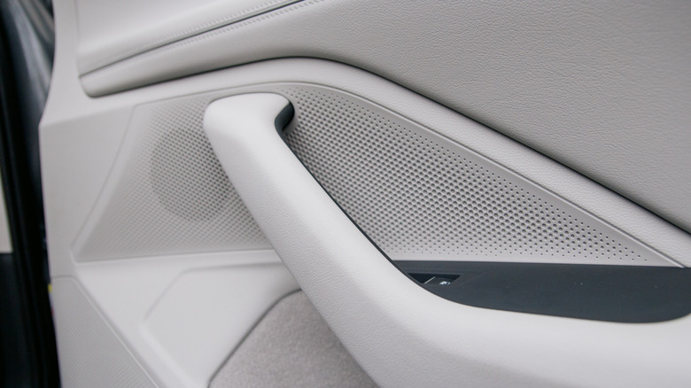 A car speaker built into a door panel.