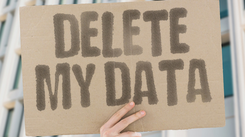 data retention protest sign that reads delete my data in large faded black letters