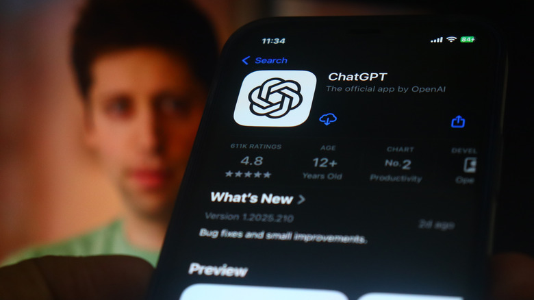 The ChatGPT iPhone app in the foreground and a blurry Sam Altman image in the background.