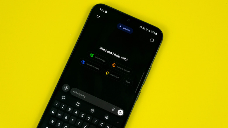 smartphone on yellow background with chatgpt app open on new chat screen