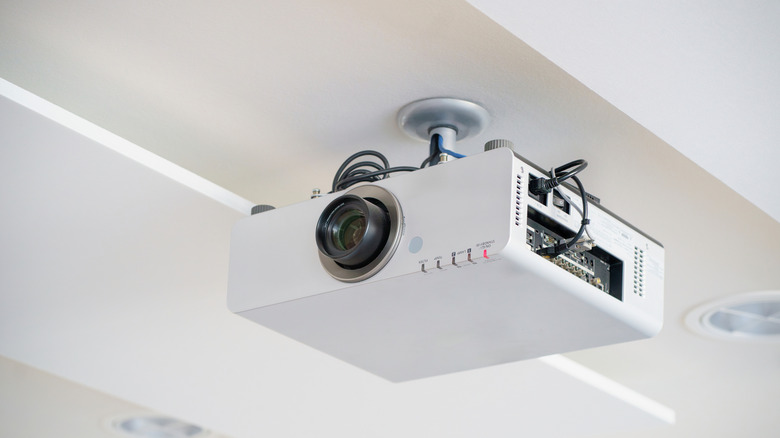 A projector mounted to the ceiling