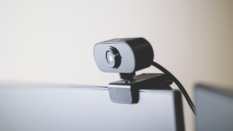 A webcam attached to an external monitor angled slightly downward