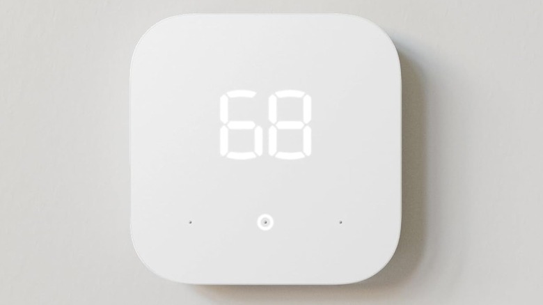 The Amazon Smart Thermostat mounted to a white wall.