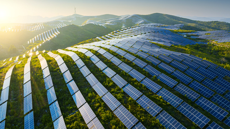 Aerial view of solar panels on a hill