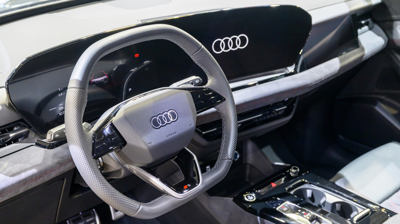 The interior of an Audi with few physical buttons and large display screens