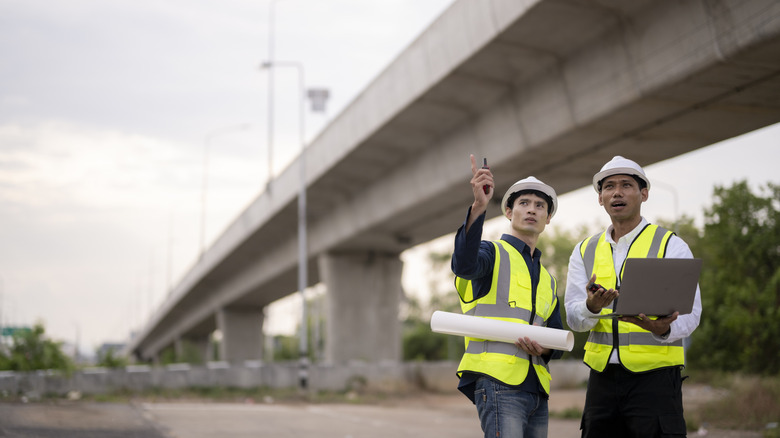 engineers discussing highway