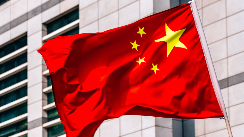 The Chinese flag standing upright in the wind