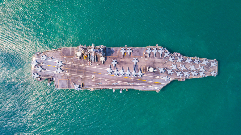 An aerial shot of the USS Gerald R. Ford naval aircraft carrier at sea.