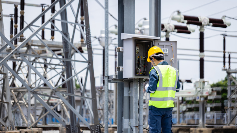 A man working to maintain the power grid