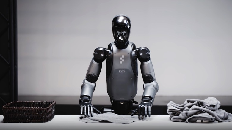 The Figure robot folding clothes.