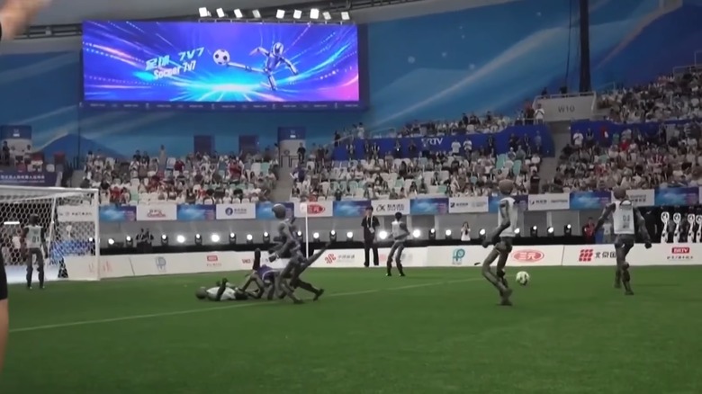 Robots playing football at the World Humanoid Robot Games in China.