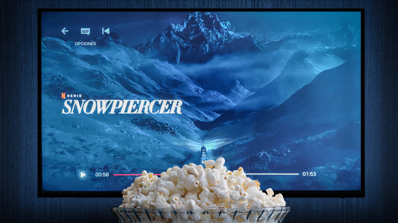 Snowpiercer title card on the screen with Netflix app open and popcorn in the foreground.