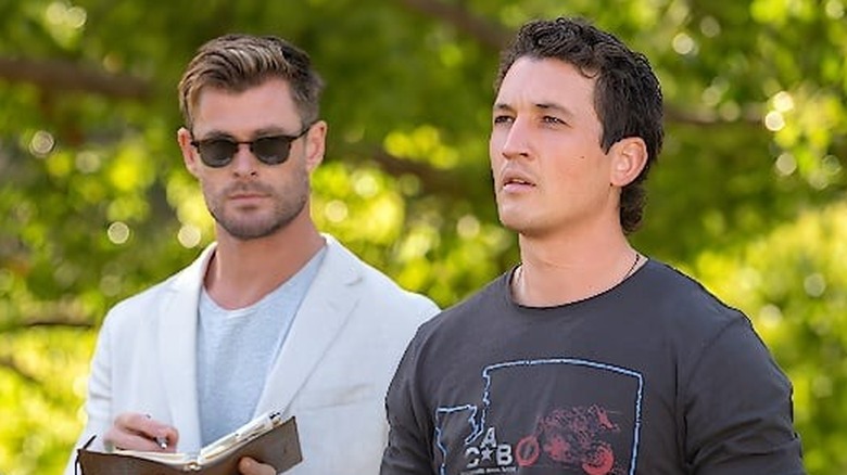 Steve (Chris Hemsworth) standing next to Jeff (Miles Teller) in "Spiderhead."