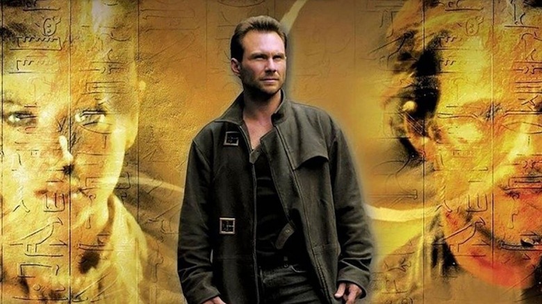Edward Carnby from "Alone in the Dark" (2005) staring ahead in front of a graphic backdrop.