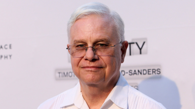 Whitley Strieber smiling at the IDENTITY: Timothy Greenfield-Sanders The List Portraits Exhibition opening in Century City, California in 2016.