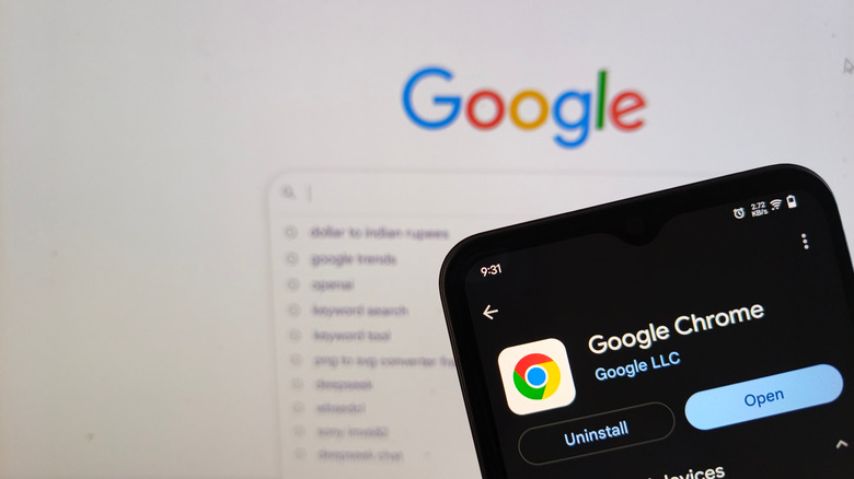 Google chrome app store page open on Android phone with google screen in background