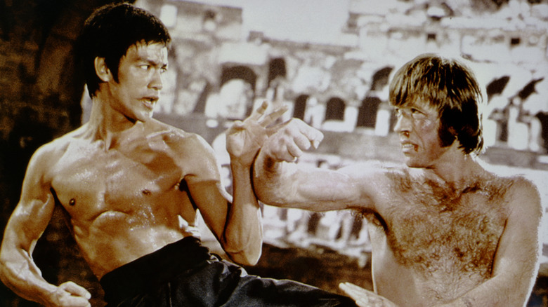 Bruce Lee and Chuck Norris (right) facing off against one another in the 1972 film "The Way of the Dragon"