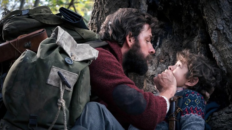 Lee Abbott (John Krasinski) covering Marcus (Noah Jupe) mouth in A Quiet Place